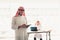 Arabian businessmen working online with tablet and technology wi