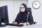 Arabian businesswoman typing on a keyboard