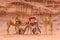 Arabian Camels gathered together in the red desert