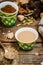 Arabian coffee with cardamon seeds - traditional coffee. Wooden background. Selective focus