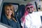 Arabian couple in a newely purchased car