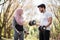 Arabian couple using dumbbells during workout at park