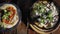 Arabian cuisine: chickpea hummus and shakshuka served on table in cafe. Top view