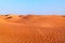Arabian desert dune background on blue sky