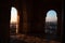 Arabian doors, with details on hand-carved walls and the sun entering through the door. Mosaic walls