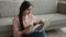 Arabian Indian happy woman using laptop computer device relax on floor at home office excited girl female freelancer