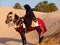 Arabian knight in the desert at sunset, Douz Tunisia, sahara desert