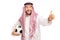 Arabian male holding football and giving thumb up