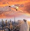 Arabian man with airplane flying over Dubai against colorful sunset in United Arab Emirates