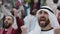 Arabian man cheering during soccer game on stadium
