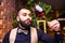 arabian man sommelier appreciating drink in lux hotel