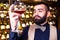 arabian man sommelier appreciating drink in lux hotel