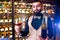 arabian man sommelier appreciating drink in lux hotel