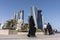 Arabian Middle Easter people walking on Corniche Broadway and Looking on the Doha Skyline View. Qatar, Middle East