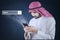 Arabian person with cellphone and search icon