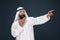 Arabian saudi businessman on dark blue studio background