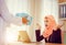 Arabic business muslim man gifting present to girlfriend at office, Romantic surprise concept