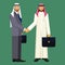 Arabic businessmen in suit and traditional clothing shake hands