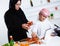 Arabic child in the kitchen with his mother