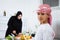 Arabic child in the kitchen with his mother