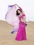 Arabic dancer holding a cloth at desert