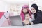 Arabic family using laptop