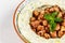 Arabic food Hummus with parsley in a traditional bowl.