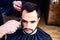 arabic handsome bearded man getting haircut at barbershop