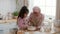 Arabic Little Girl Tasting Dough Making Cookies With Mother Indoor