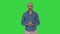 Arabic man in casual making attention gesture finger up on a Green Screen, Chroma Key.