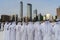 Arabic men standing in traditional cloth around modern buildings - Middle Eastern Culture - Emirati Men performing Al Ayala