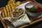 arabic middle eastern falafel wrap with potato chips and pickle in close up