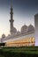 Arabic mosque facade with domes, with sunset light. Great Mosque. UAE. Abu dhabi