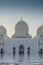 Arabic mosque facade with domes, with sunset light. Great Mosque. UAE. Abu dhabi