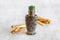 Arabic oud oil perfume in silver bottle with crystals and sticks of tree
