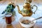 Arabic style coffee cup and kettle with oatmeal bowl
