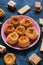 Arabic sweets. A variety of oriental sweets on a blue background. Baklava, halva, sherbet, sesame.