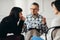 Arabic woman listening to her psychotherapist during support group for abuse survivors meeting