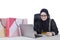 Arabic woman shopping online with notebook