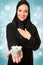 Arabic woman, traditional dressed holding present