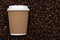 Arabica coffe aroma and takeout beverages concept with generic recyclable brown cardboard and paper cup with white plastic lid on