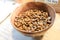 Arabica coffee beans in wooden bowl on table