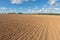 Arable field farm and blue sky