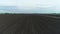Arable land, excavated agricultural field, aerial view. Plowed land before sowing