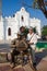 ARACATACA, COLOMBIA - FEBRUARY 1, 2024: Senior woman tourist next to the monument in honor to the Colombian Nobel Prize of