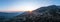 Arachova Greece mountain town aerial panorama. Traditional houses at sunset