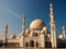 arafed view of a large white building with many domes, with beautiful mosques