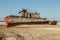 Aral sea disaster. Abandoned rusty fishing boat at the desert on the place of former Aral sea