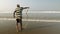 Arambol, Goa, India - December 30, 2019: Indian fisherman releases a snake into the sea, which got into the net