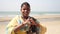 Arambol, India - January 2020. Indian woman makes a heart shaped sign with her hands.